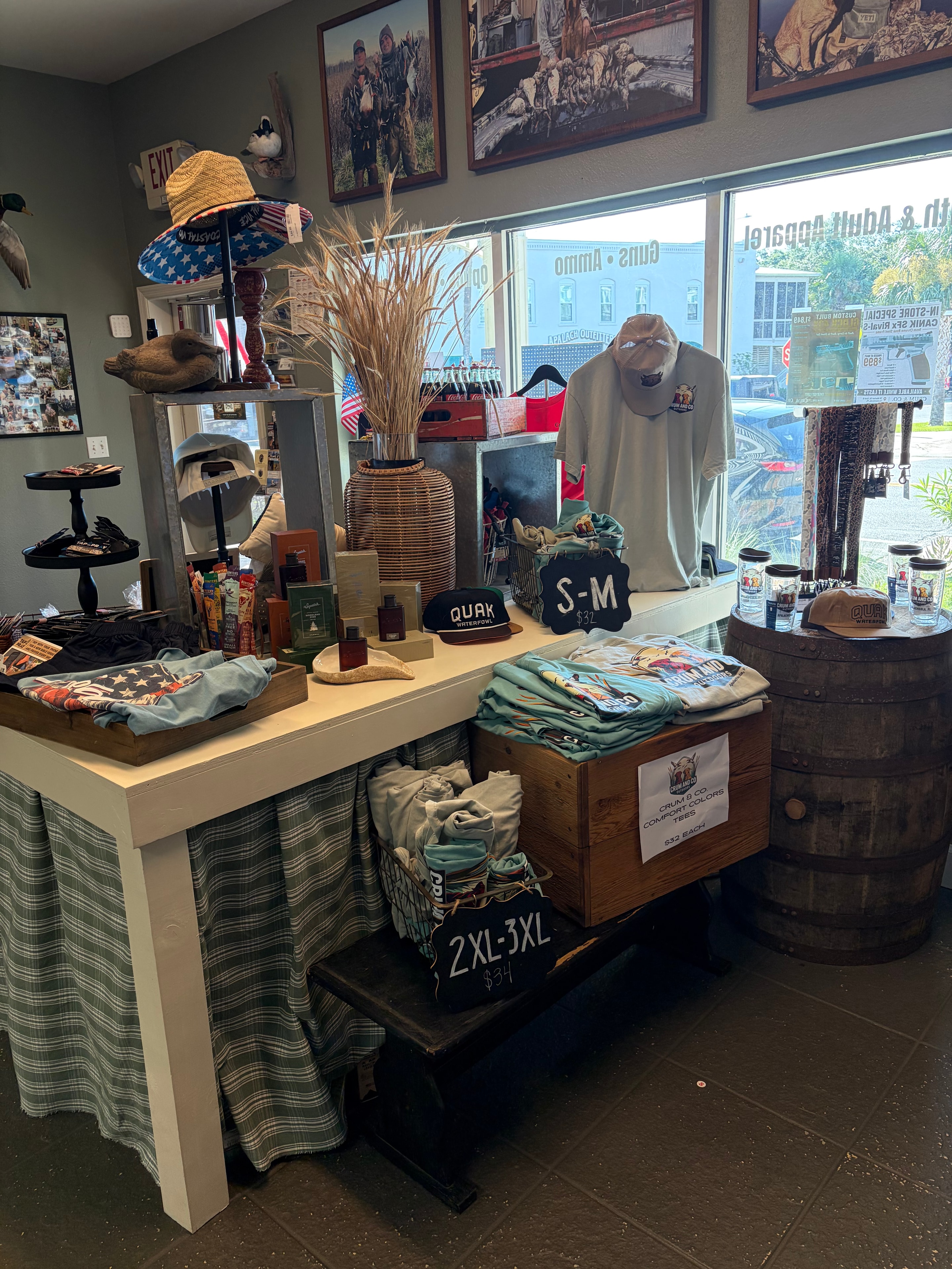 Store interior showing apparel and gift merchandise